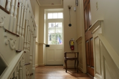 looking up staircase toward street