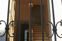 through wrought iron and door